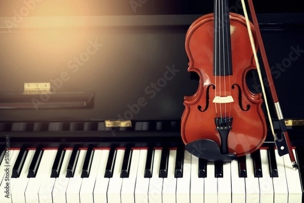 Fototapeta Classical violin placed vertically on the piano. leave space for text