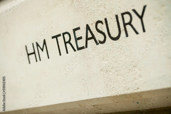 Fototapeta Angled view of HM TREASURY sign on Whitehall building in London, UK.
