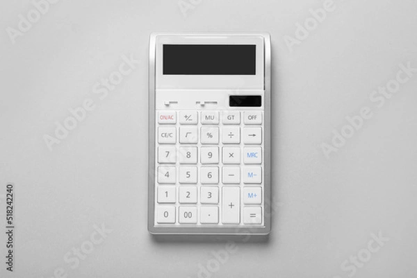 Obraz White calculator on light background, top view