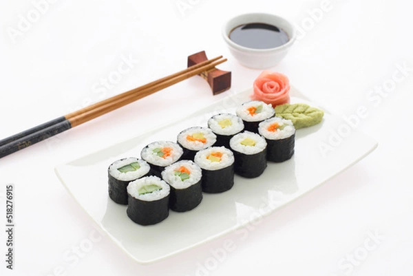 Obraz Maki Sushi. Delicious sushi rolls on white plate with chopsticks and wasabi