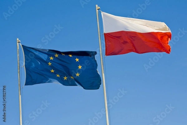 Obraz European union flag and a Polish flag on a background of sky