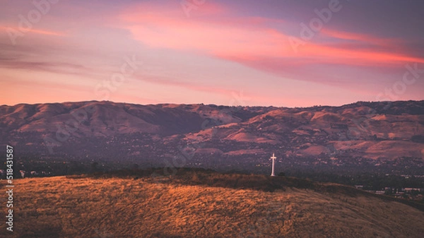 Obraz sunset over cross on the mountains