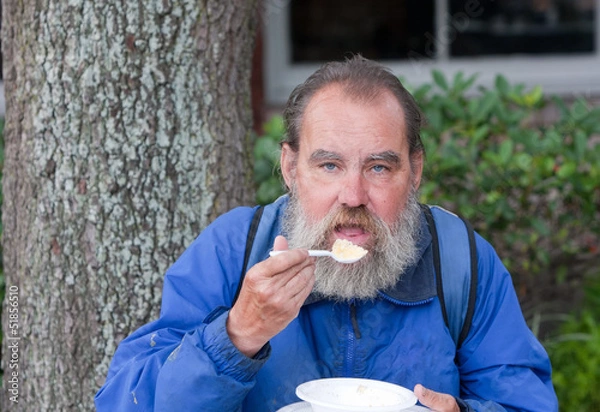 Obraz Homeless man eating