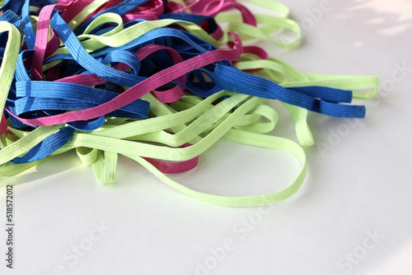 Fototapeta Pile of elastic band close-up. Various elastic cord for clothes.