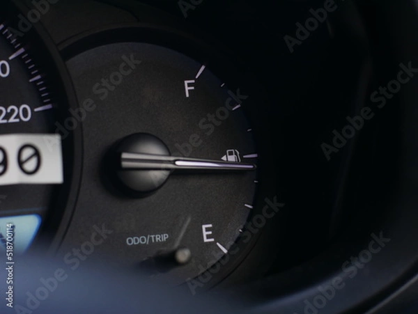 Fototapeta Fuel meter in the car. Fuel Gauge half empty. 