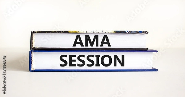 Fototapeta AMA ask me anything session symbol. Concept words AMA ask me anything session on books on a beautiful white table white background. Business and AMA ask me anything session concept. Copy space.