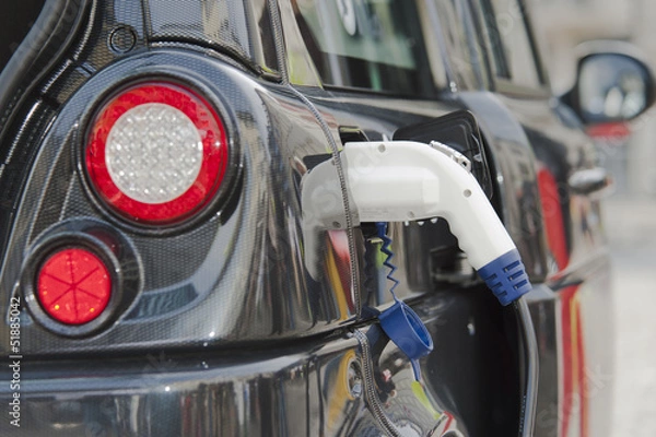 Fototapeta Electric vehicle charging