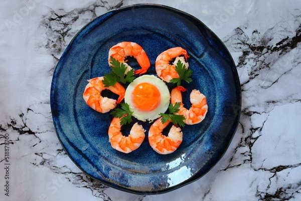 Obraz shrimp and fried egg on a plate