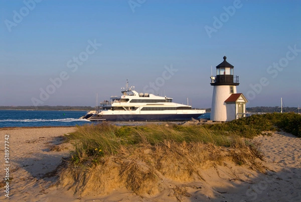 Fototapeta Ferry Passes By Lighthouse on Nantucket Island Off Cape Cod