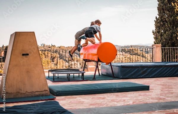 Obraz Parkour training Fitness equipment skill jumping blocks trapezoidal combination, outdoor sport summer camp, mats for acrobatic