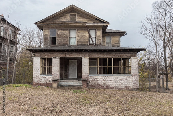 Obraz Two story house left abandoned in Birmingham neighborhood