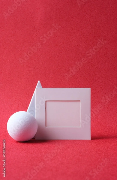Fototapeta mockup blank paper frame with pedstall on red background