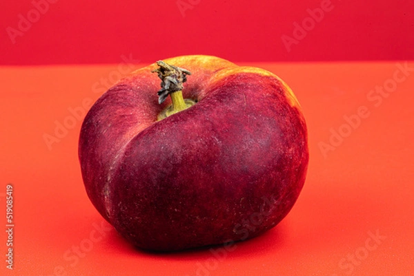 Obraz Donut Peaches isolated in red background