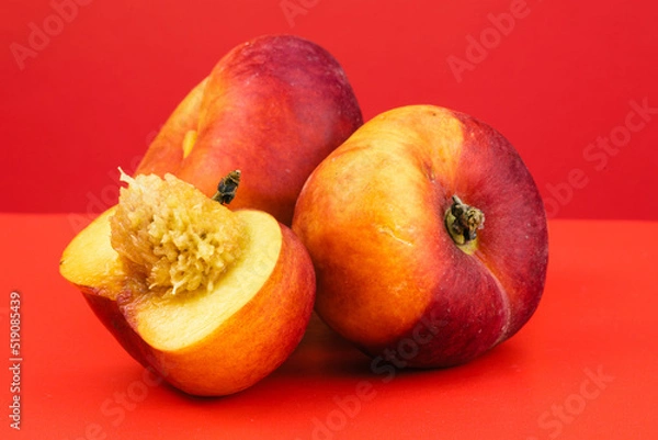 Obraz Donut Peaches isolated in red background