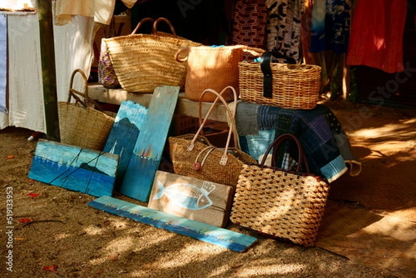 Obraz Sea drawings on wooden planks are combined with handmade bags.