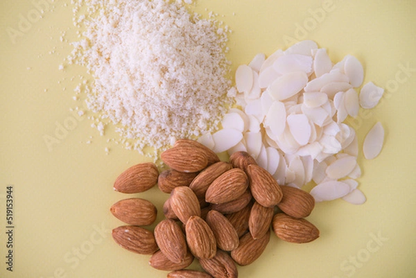 Obraz almonds, flakes and flour made from it. top view