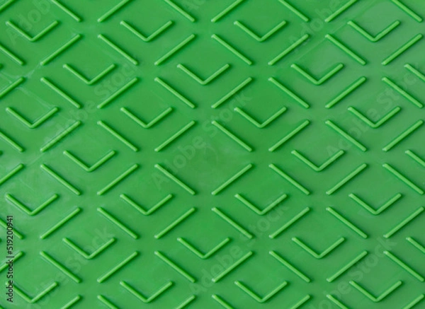 Obraz Green plastic surface with repetitive geometric shapes. Seamless geometrical patterns with rhombuses, lines and corners. Stamped plastic surface with simple geometric lines. Space for inserting text