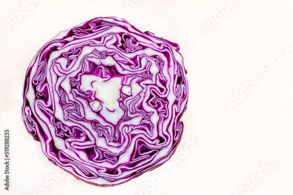 Obraz photo of sliced red cabbage from top with copy space. Close up pattern of purple color cabbage