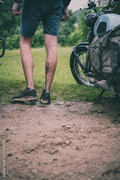 Obraz a retro motorcycle tourer with muddy feet