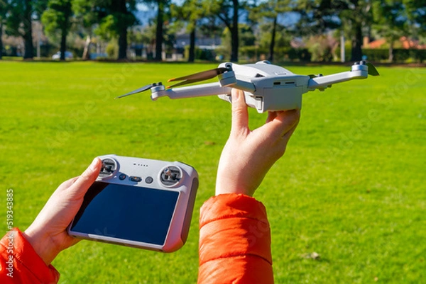 Fototapeta Hand launching a drone