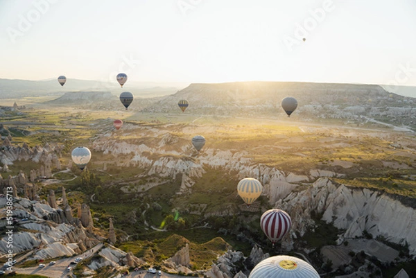 Obraz Sunrise landscape in Cappadocia, with all the hot air balloons flying, aerial views from another balloon