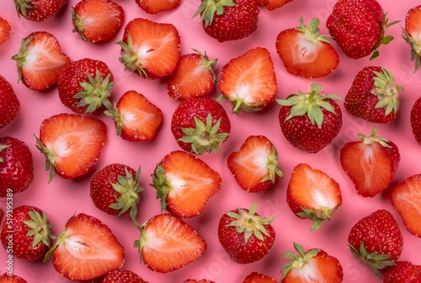Obraz ripe sliced strawberries on a pink background, trendy, bright, summer background