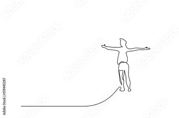 Fototapeta a young man climbs to the top with open arms and looks at the skyline happily and hopefully