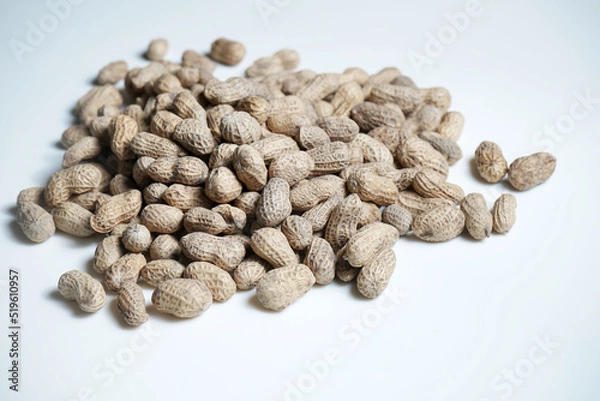Fototapeta Peanuts background made up of salted peanuts in their shells