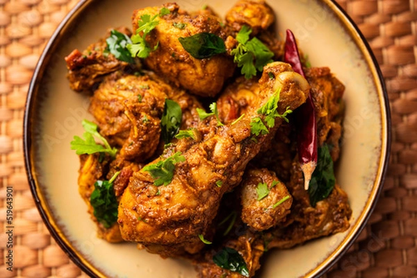 Fototapeta Sukha mutton or chicken, dry spicy Murgh or goat meat served in a plate or bowl