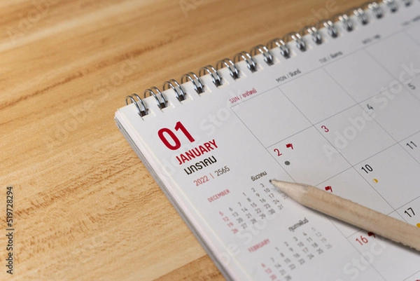 Obraz Jan month 2022 Calendar page with pencil business planning concept on wooden background