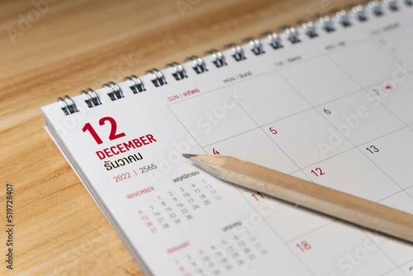 Fototapeta Dec month 2022 Calendar page with pencil business planning concept on wooden background