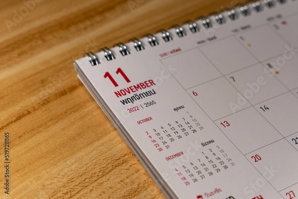 Obraz Nov month 2022 Calendar page on wooden background