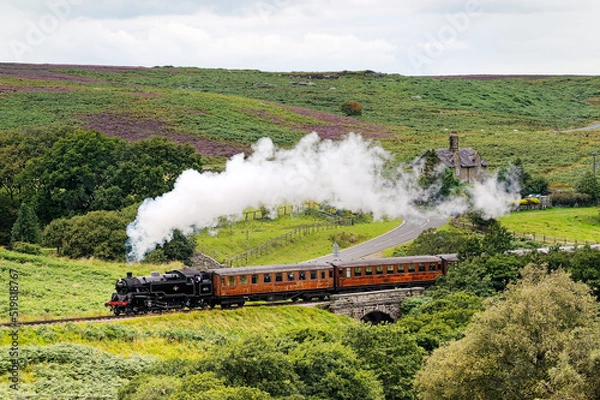 Fototapeta North Yorkshire Moors Railway. Vintage steam locomotive railway engine No.80072 pulls train south from Goathland, England, UK