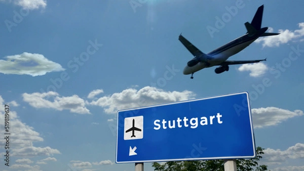 Fototapeta Plane landing in Stuttgart Germany airport with signboard