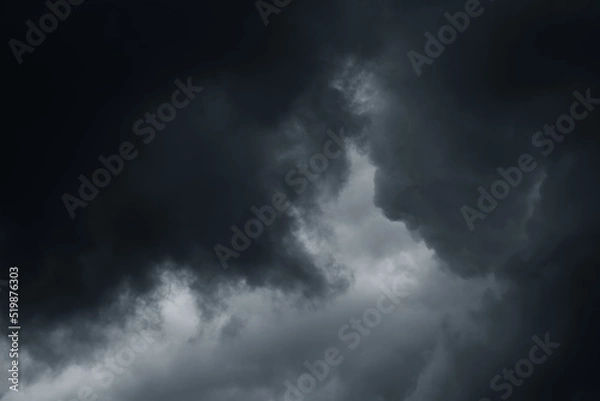Fototapeta Stormy rain big fluffy clouds. Dark sky. Natural scenic abstract background. Weather changes backdrop. Sky filled with voluminous clouds.