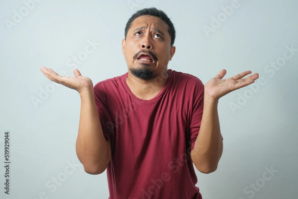 Obraz funny expression of man with eye rolled