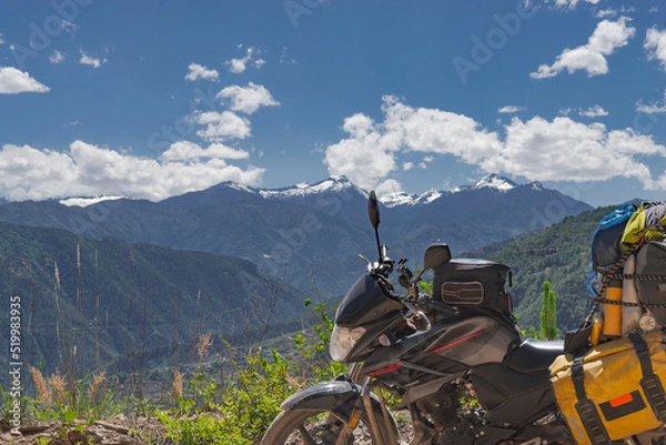 Obraz Sideview of touring Motorcycle stopped at the mountain peak