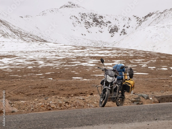 Obraz Touring motorcycle and snow covered mountains