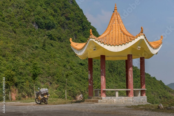 Obraz Yellow asian style pavilion located in green mountains