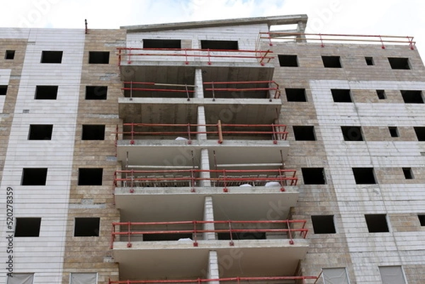 Fototapeta Work and working tools at a construction site in Israel.