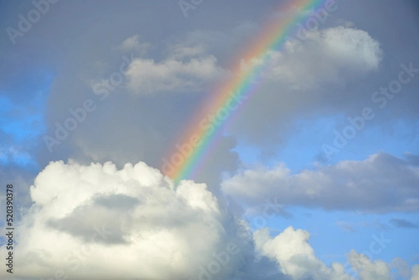 Fototapeta clouds and rainbow photography with long-focus optics