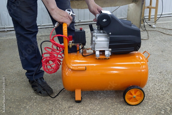 Fototapeta The compressor is portable for purging operations. Equipment for production.