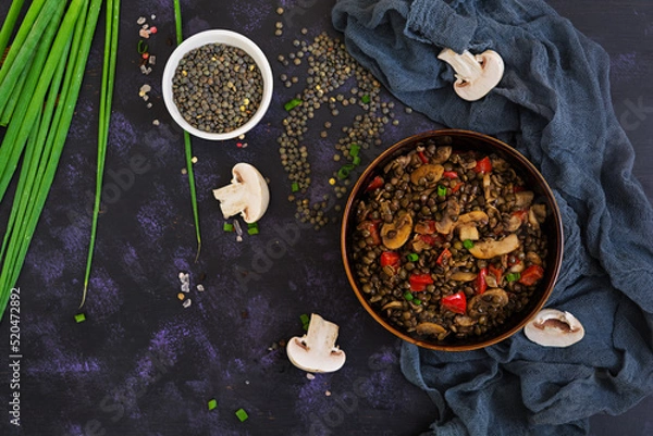 Obraz Delicious lentils with pepper and mushrooms on dark background