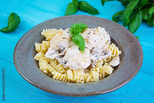 Obraz Meatballs with fusilli, cream and mushrooms on wooden background