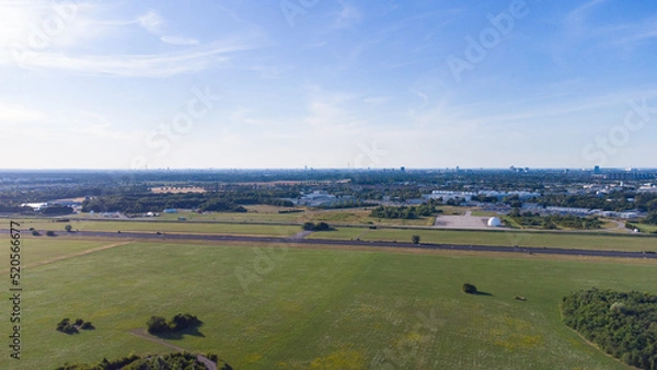 Fototapeta Aerial view from plane landing. Runway of former airport in Neubiberg, south Germany seen from above