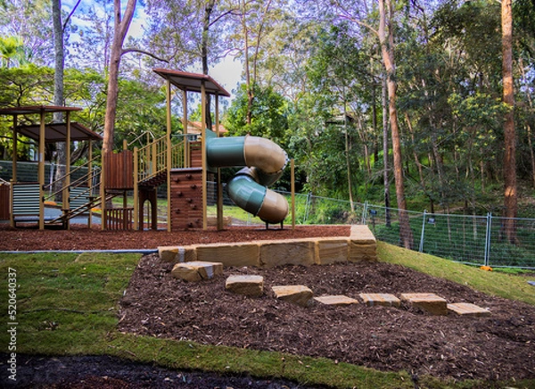 Fototapeta Kids playground with swings and a slide