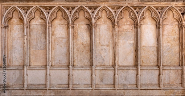 Fototapeta Gothic pointed arches on the outside wall of a church