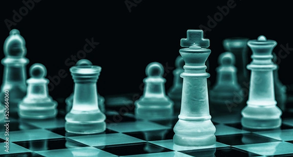 Obraz Glass chess on chess board. Close up with the black background