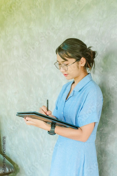 Obraz Office girl with laptop working in the tech world
