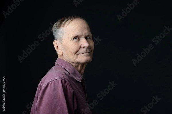Obraz senior  looking at camera on black background